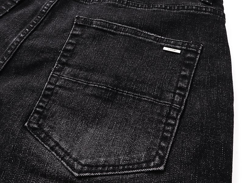 AMIRI Varsity Letter Appliqu¨¦ Distressed Jeans ¡ª detail